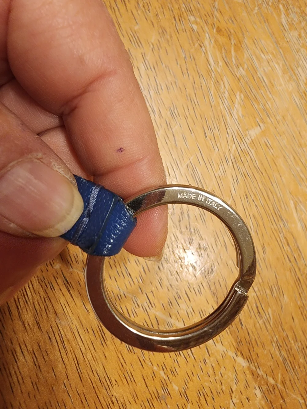 blue leather Fendi logo plaque keychain features silver-tone hardware